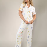 Z Supply Vintage Tropic pants in cream with elastic waistband and vibrant tropical motifs.