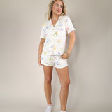 Z Supply Tropic sleep shorts in cream with elastic waist and whimsical tropical illustrations.