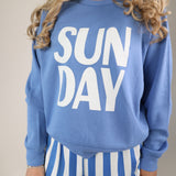 Relaxed Z Supply Sunday sweatshirt in blue with playful white lettering and cozy crewneck style.
