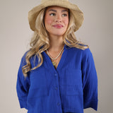 Women’s Z Supply Helena button-up shirt in bright blue featuring a soft gauze texture and relaxed fit.