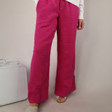 Women’s Sundry wide leg lounge pants in vibrant pink featuring an easy pull-on waist and flowy silhouette.