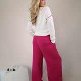 Sundry wide leg lounge pants in bold pink with lightweight textured fabric and a relaxed style.