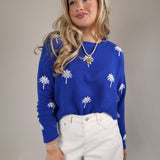 Casual Z Supply Sienna Palm sweater in blue with all-over white palm tree design and long sleeves.