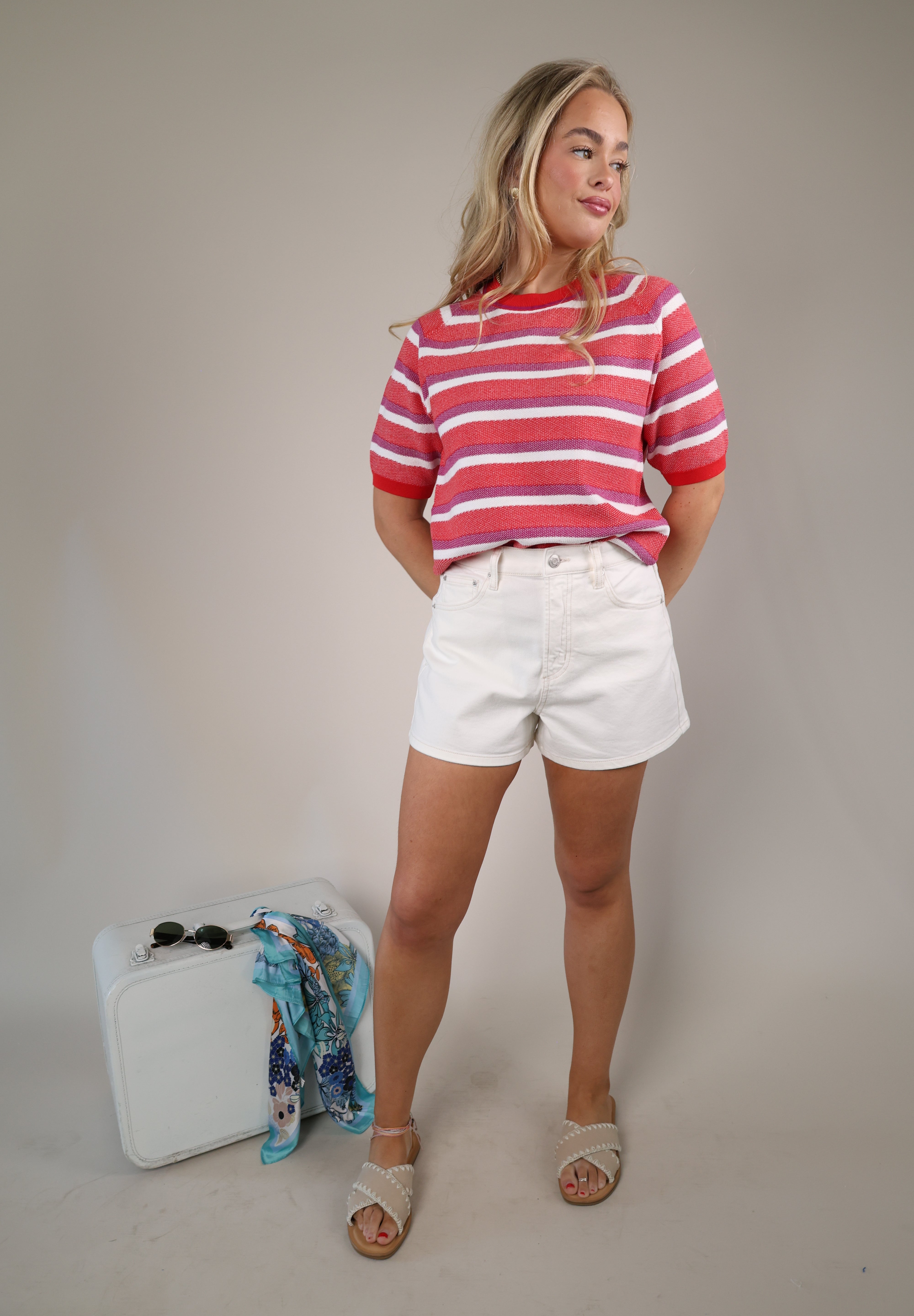 Women’s Sundry striped crewneck sweater featuring pink and white horizontal stripes and soft knit texture.