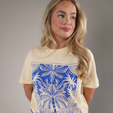 Casual Z Supply Palm Boyfriend tee in pale yellow with a large blue tropical graphic and relaxed silhouette.