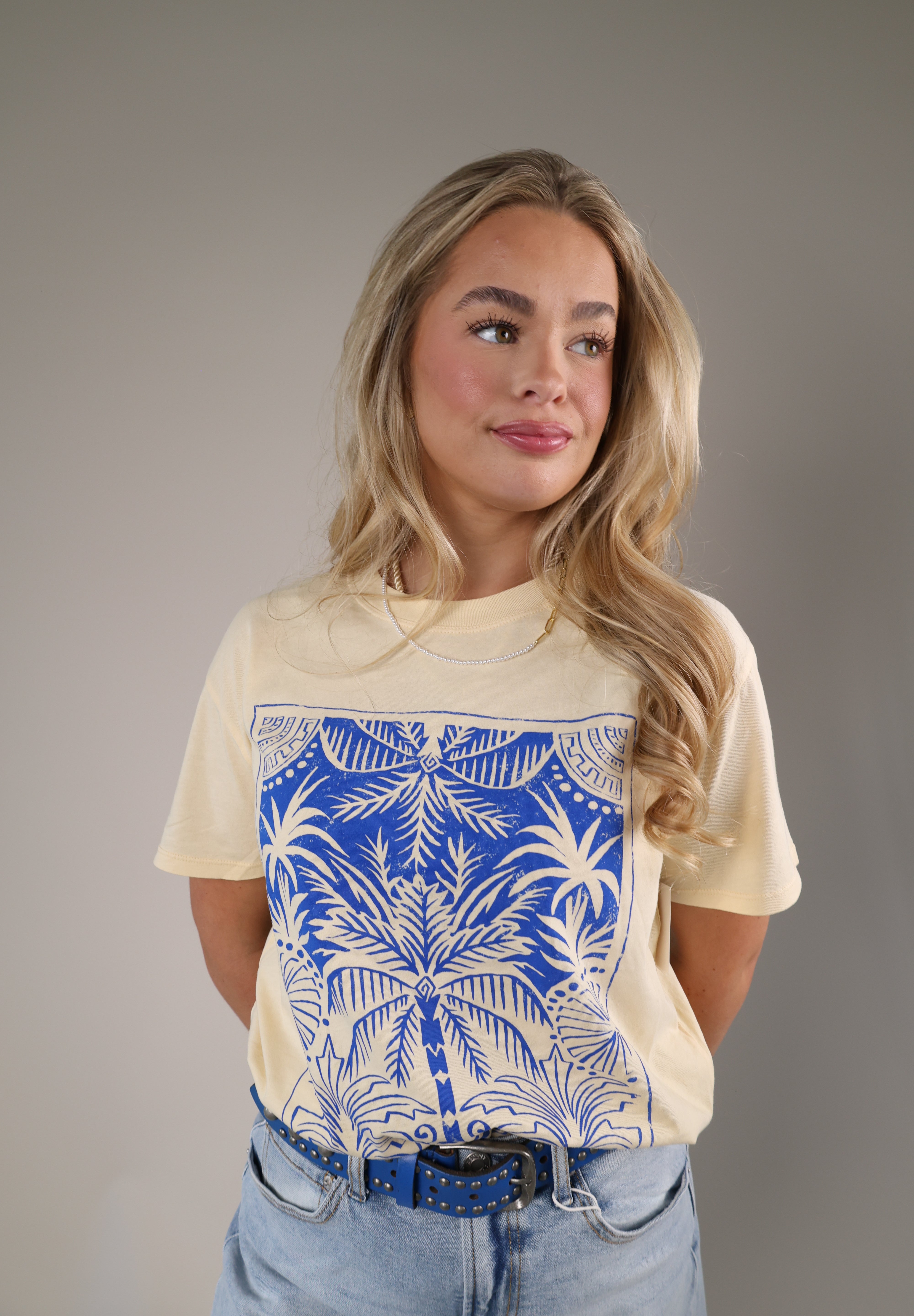 Casual Z Supply Palm Boyfriend tee in pale yellow with a large blue tropical graphic and relaxed silhouette.