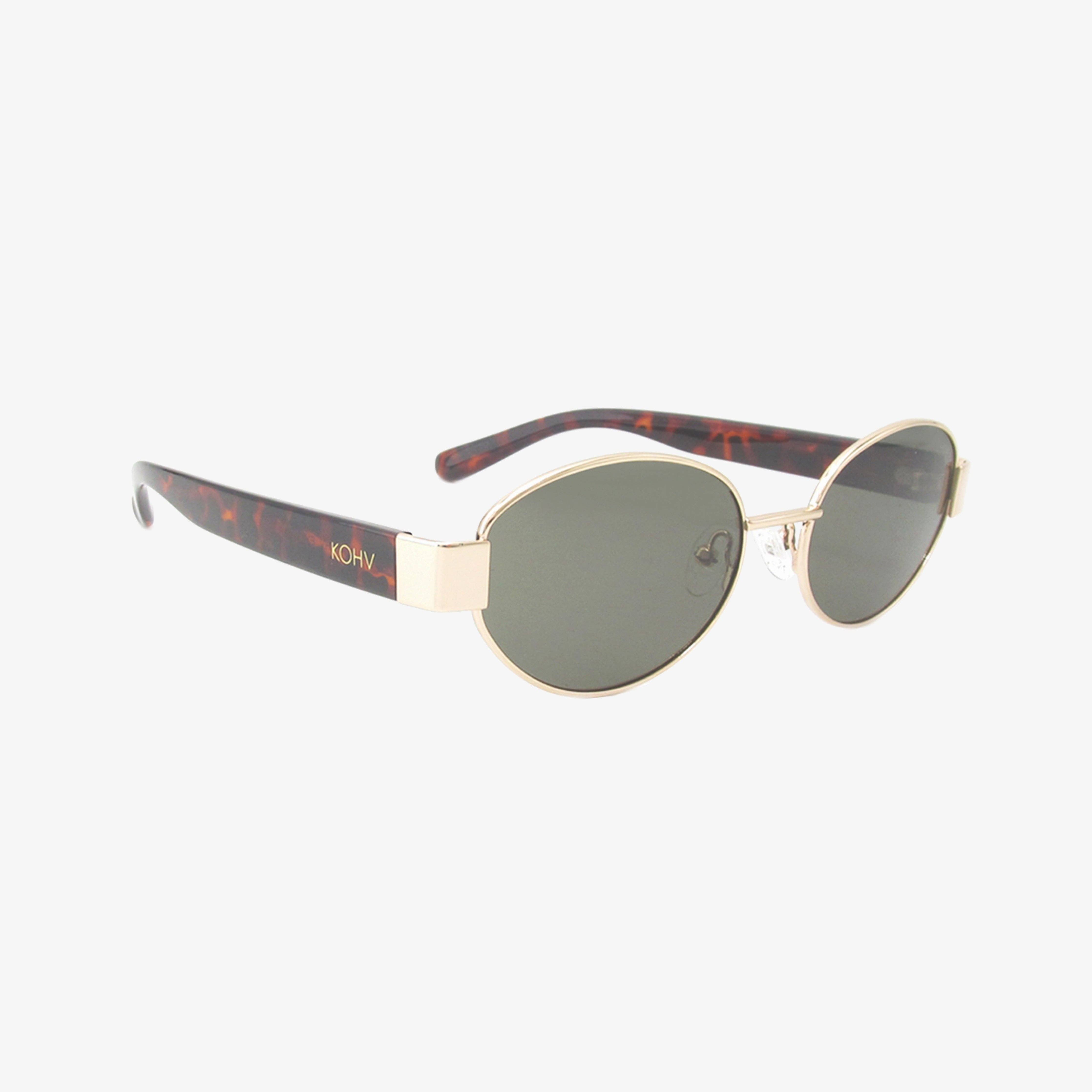 Kohv Coco sunglasses with oval gold frame, tortoise arms, and polarized green lenses