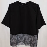 Oversized women’s crew neck top paired with denim for an effortless casual boutique look
