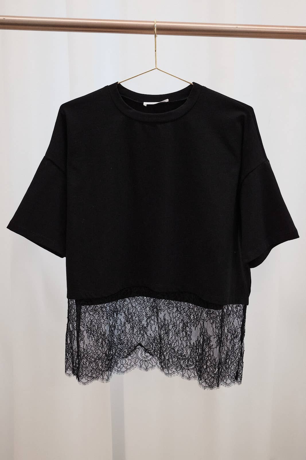 Oversized women’s crew neck top paired with denim for an effortless casual boutique look