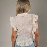 White eyelet button up top Shear Boutique spring 2026 feminine blouse casual chic outfit