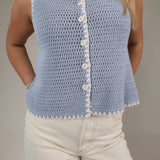 Women’s blue sweater vest Shear Boutique spring collection 2026 sleeveless knit top casual outfit