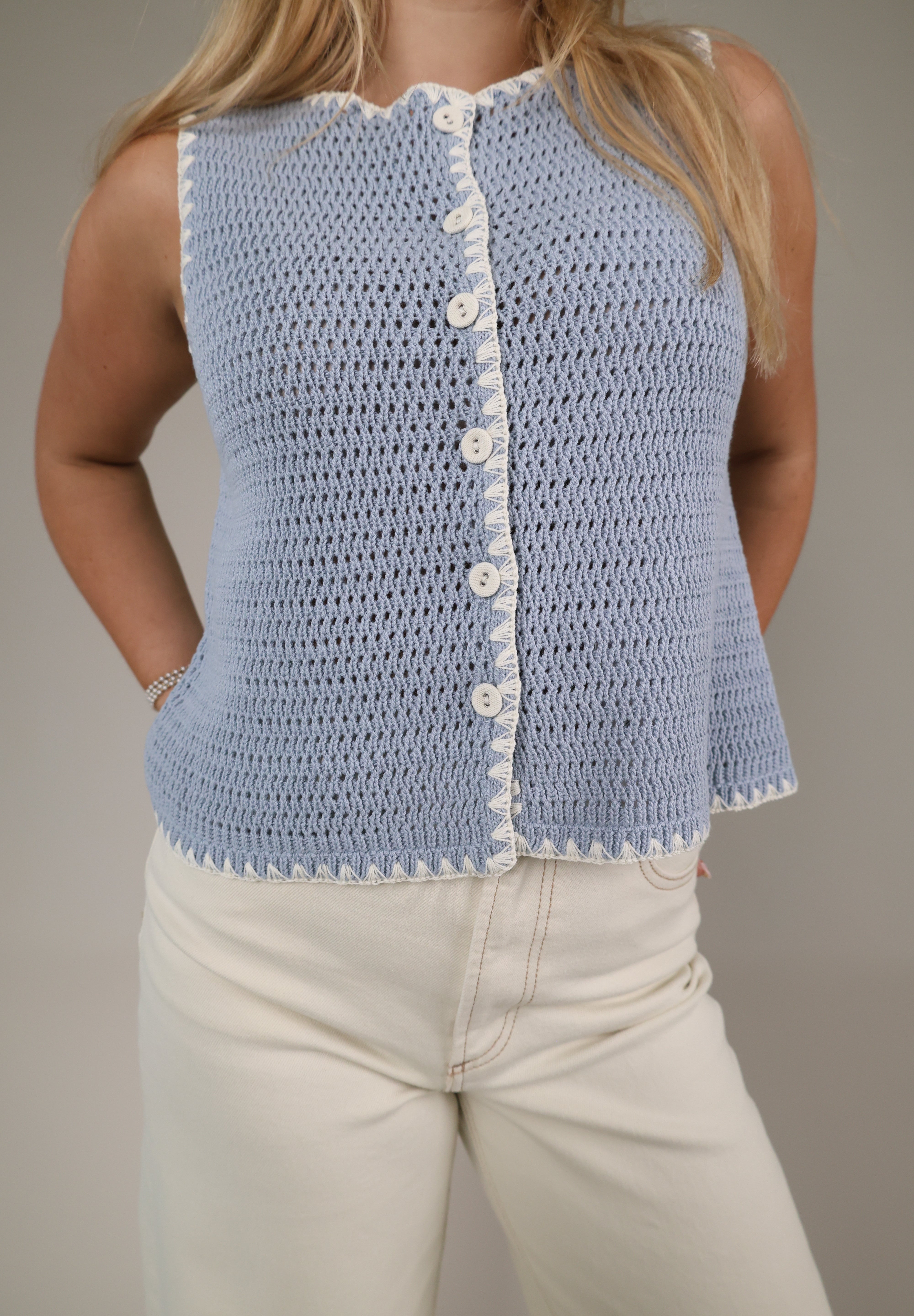 Women’s blue sweater vest Shear Boutique spring collection 2026 sleeveless knit top casual outfit