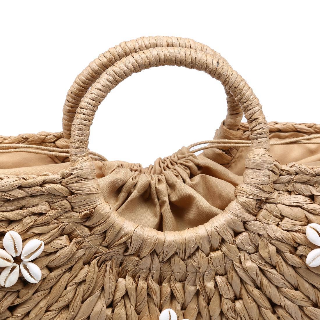 Oversized natural raffia-inspired Coast Tote with shell flower accents for effortless everyday summer looks
