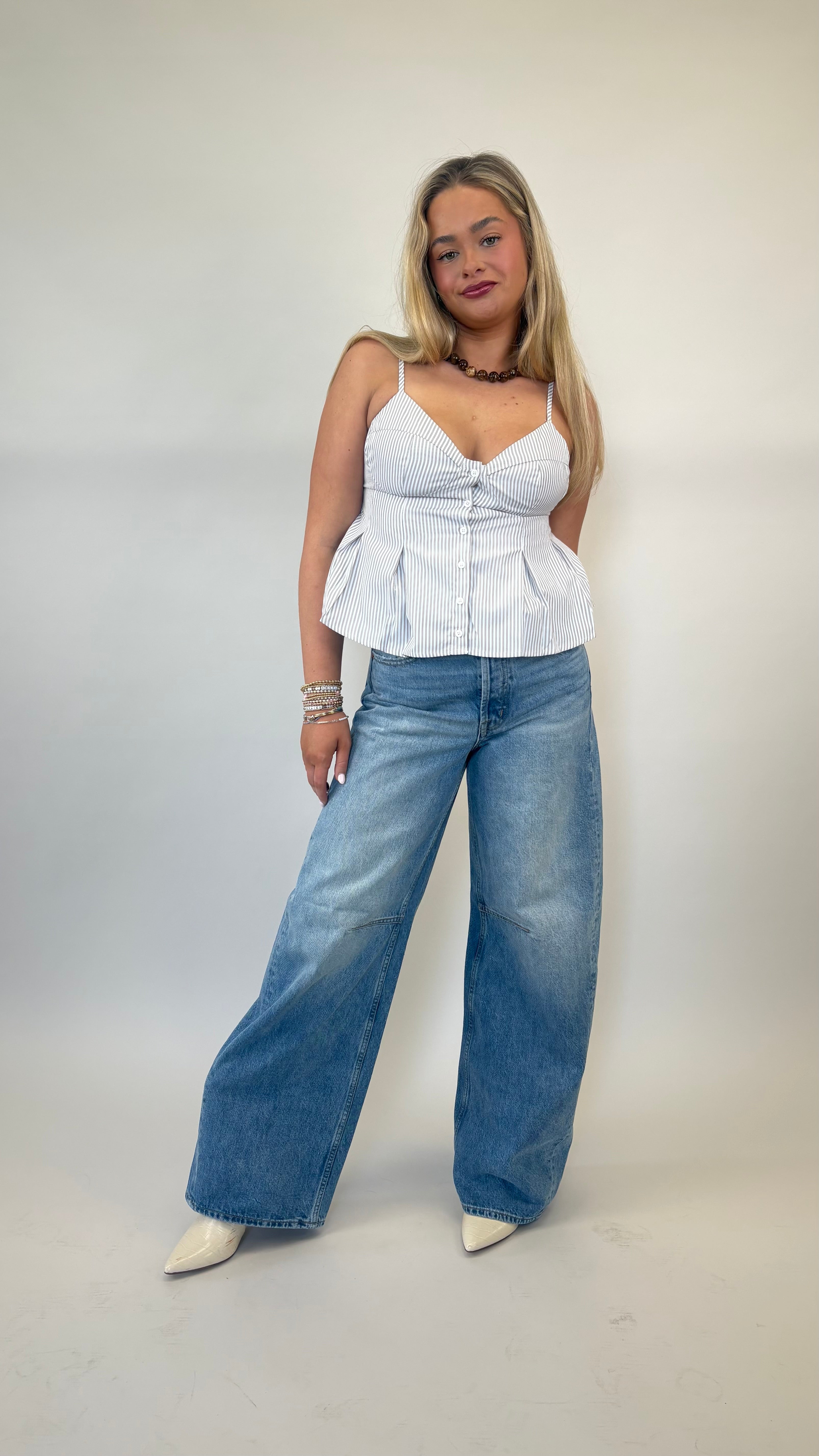 Deluc Corvo button-front top with olive and cream stripes and feminine peplum hem