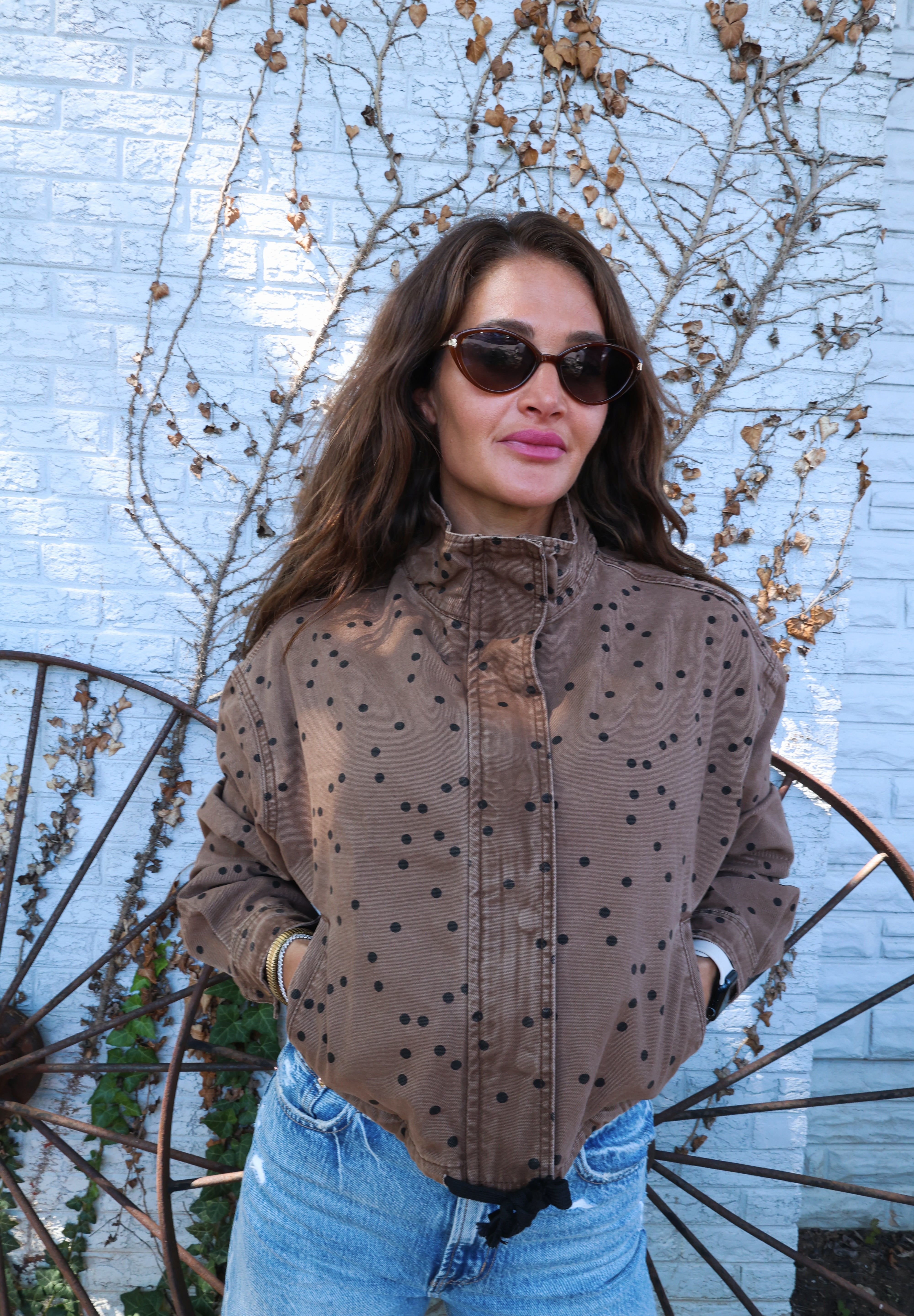 Chic brown cropped jacket styled with denim for an elevated everyday fall look