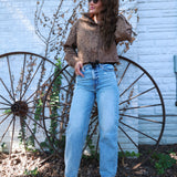 Women’s brown funnel neck jacket with contrast braided trim and asymmetric front