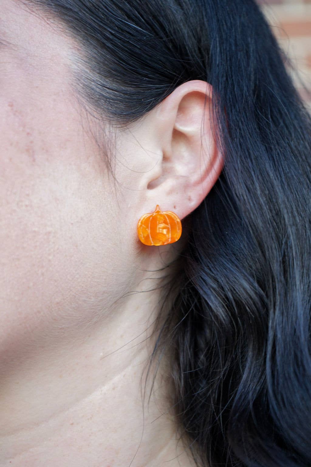 Orange pumpkin-shaped studs by Spiffy and Splendid — lightweight design adds a playful autumn touch to any outfit.