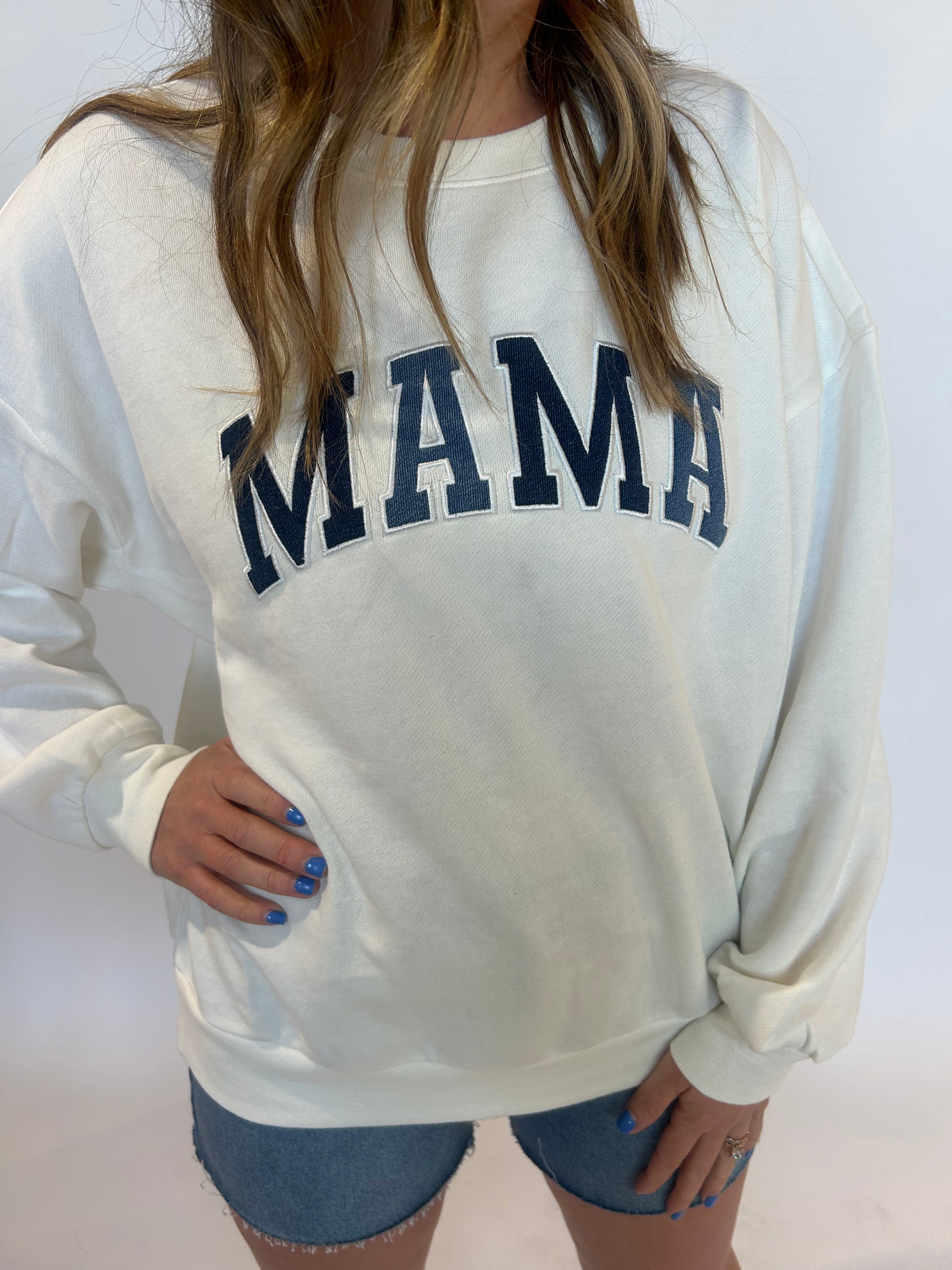 Close up of sweatshirt with "Mama" on the front