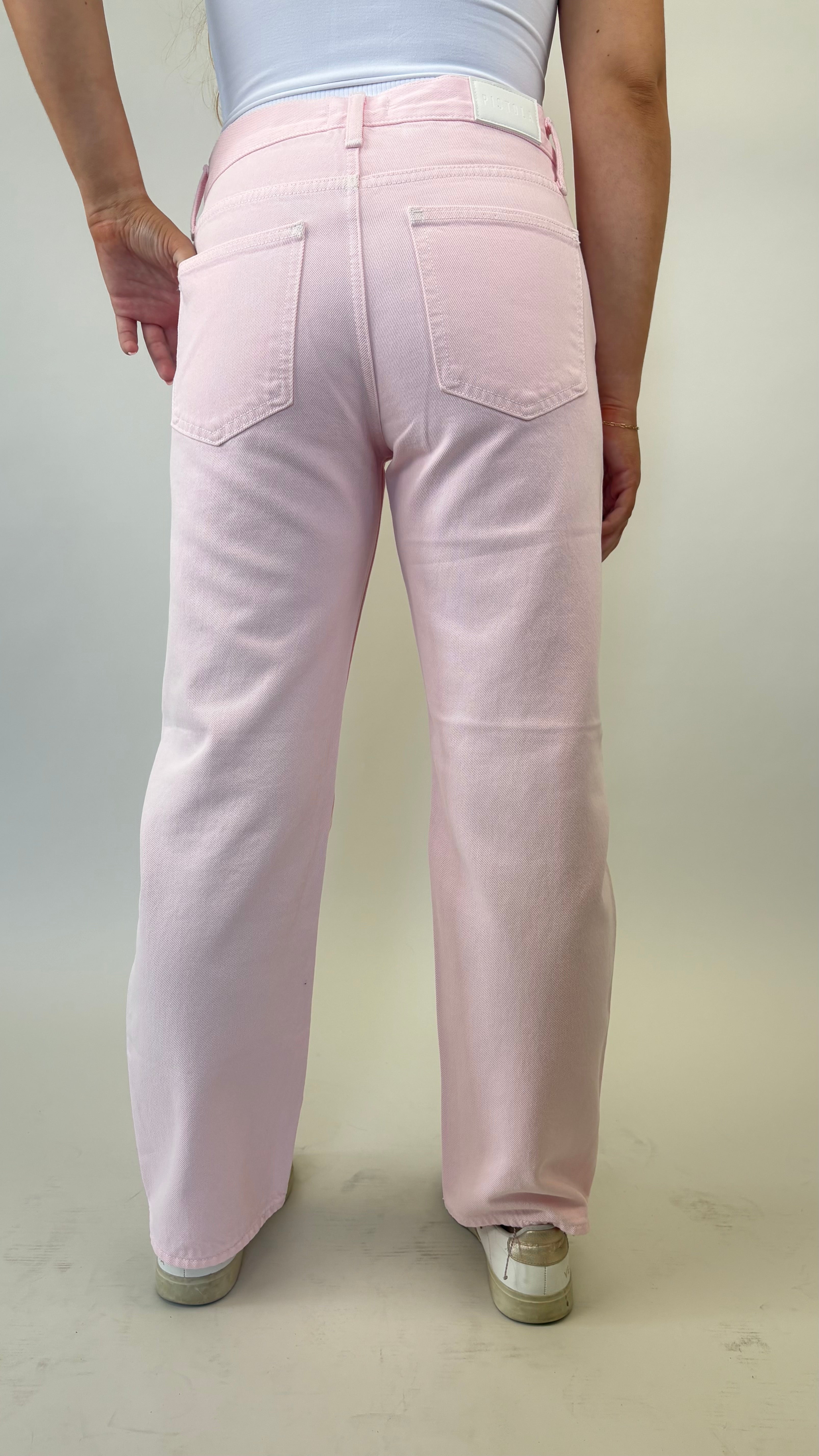 Blush pink Pistola Lexi jeans featuring mid rise fit and bowed straight leg