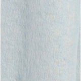 Close-up of Free People blue blanket scarf highlighting soft fabric and white fringe trim.