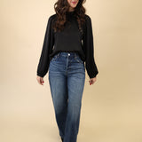 Silvana Embroidered Top in black from Z Supply with refined scalloped trim, a mock neck, and full-length sleeves.