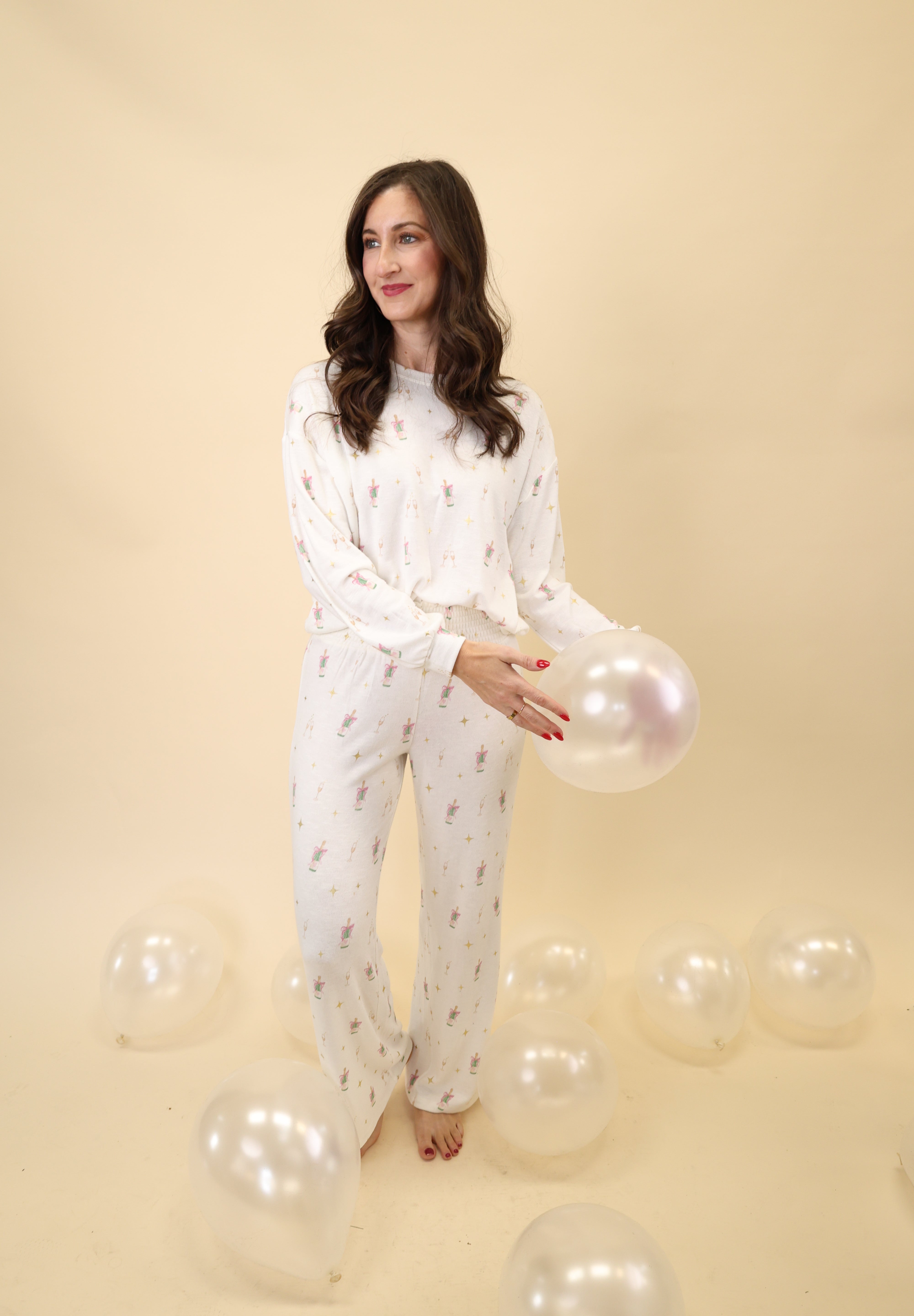 Z Supply soft crewneck long sleeve with a celebratory champagne toast print and a laid-back relaxed fit.