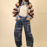 Navy bandana-print barrel pants with a mid to high rise and a relaxed, curved leg shape.