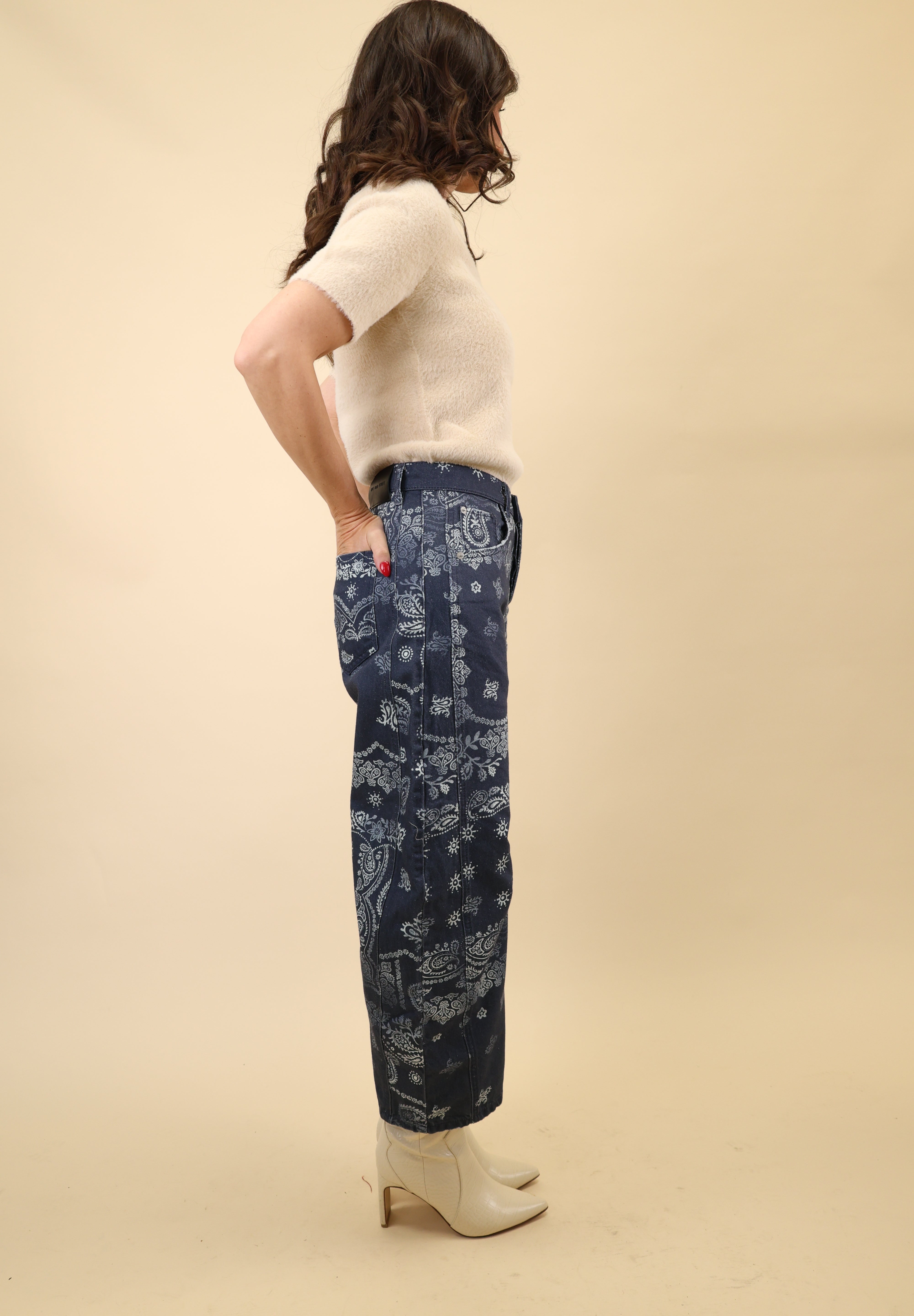 Curved barrel-leg pants in a navy bandana print, designed with a mid to high rise waist.