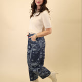 Free People Good Luck barrel pants in a navy bandana pattern, featuring a mid to high rise and roomy barrel leg.