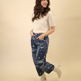 Cream short-sleeve knit top offering a clean, minimal silhouette from Dear John.