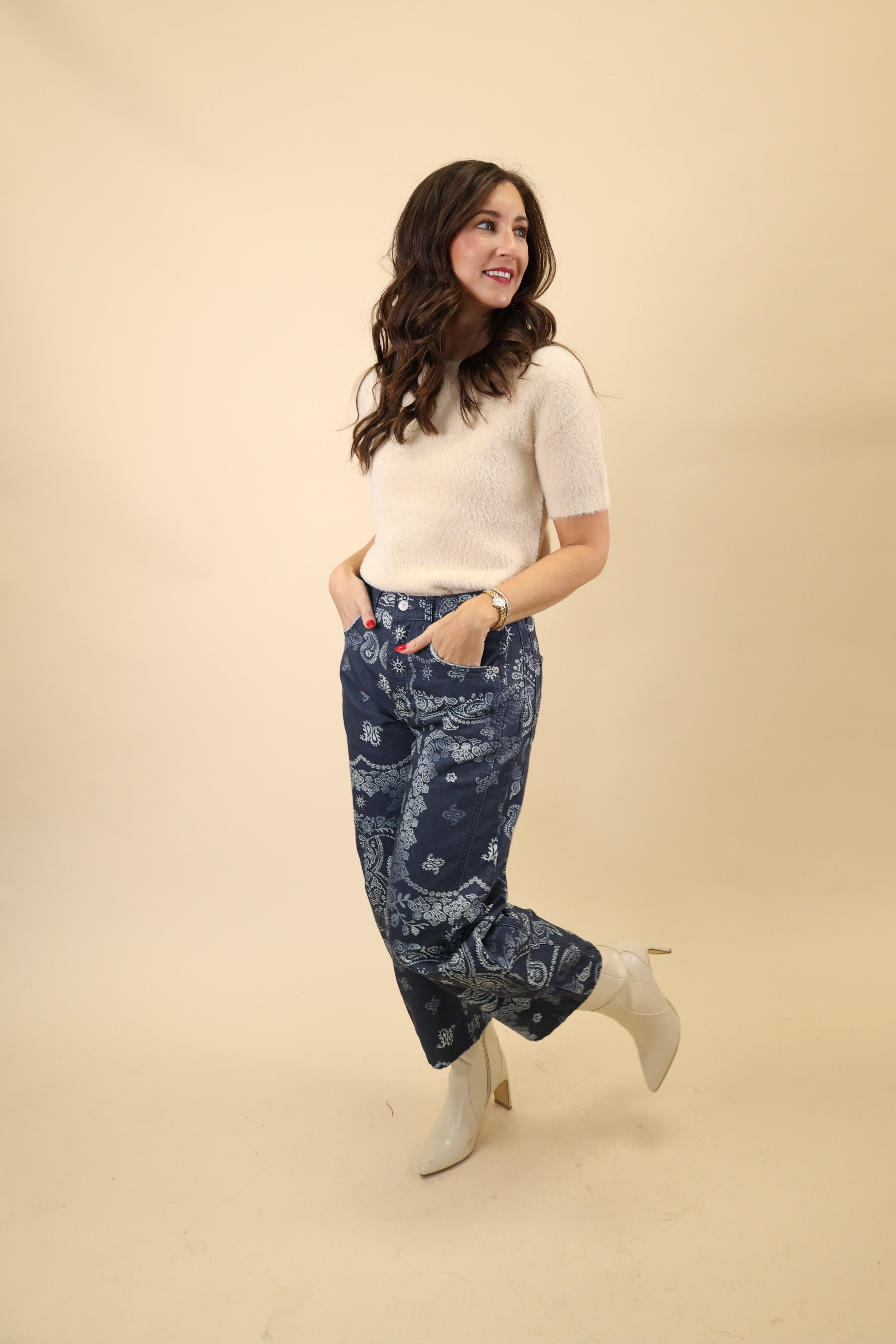 Cream short-sleeve knit top offering a clean, minimal silhouette from Dear John.