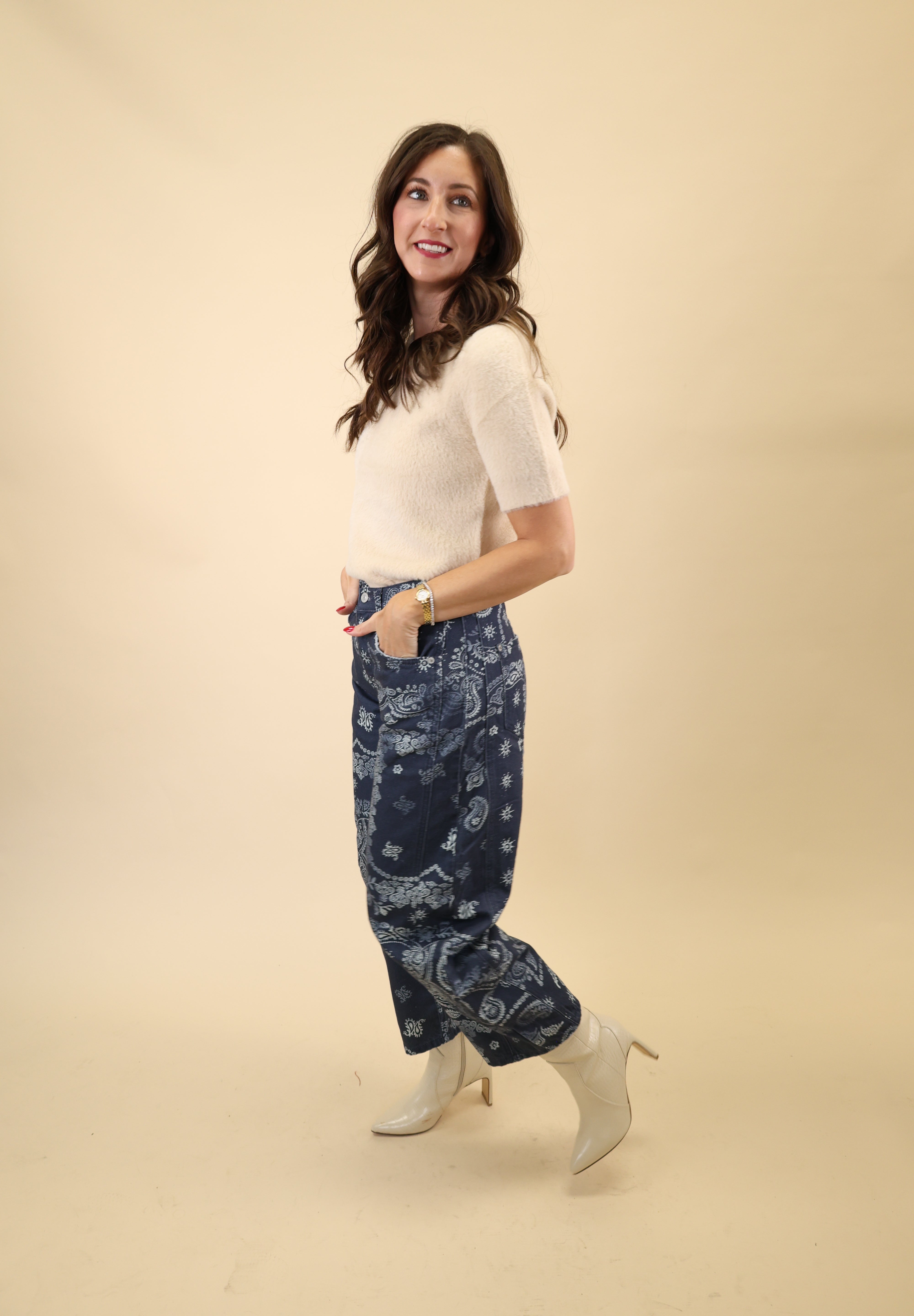 Cream knit short-sleeve sweater top featuring a lightweight, refined texture from Dear John.