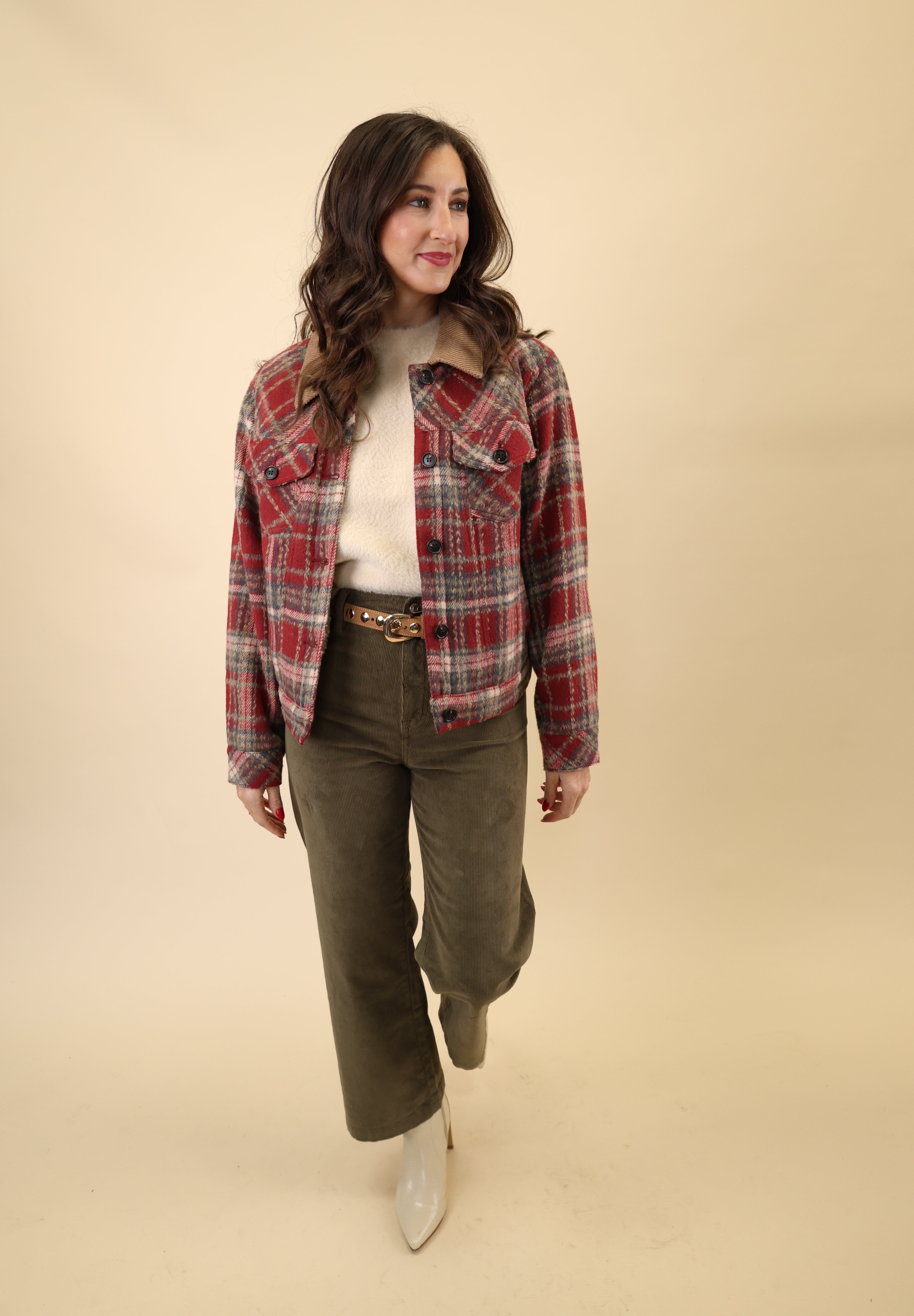 Owen Trucker Jacket in red plaid featuring sherpa lining, button front, long sleeves, welt pockets, and structured waistband and cuffs.