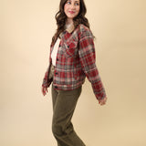 Warm sherpa-lined plaid jacket with long sleeves, front welt pockets, button front, and classic cuff-and-waistband detailing.