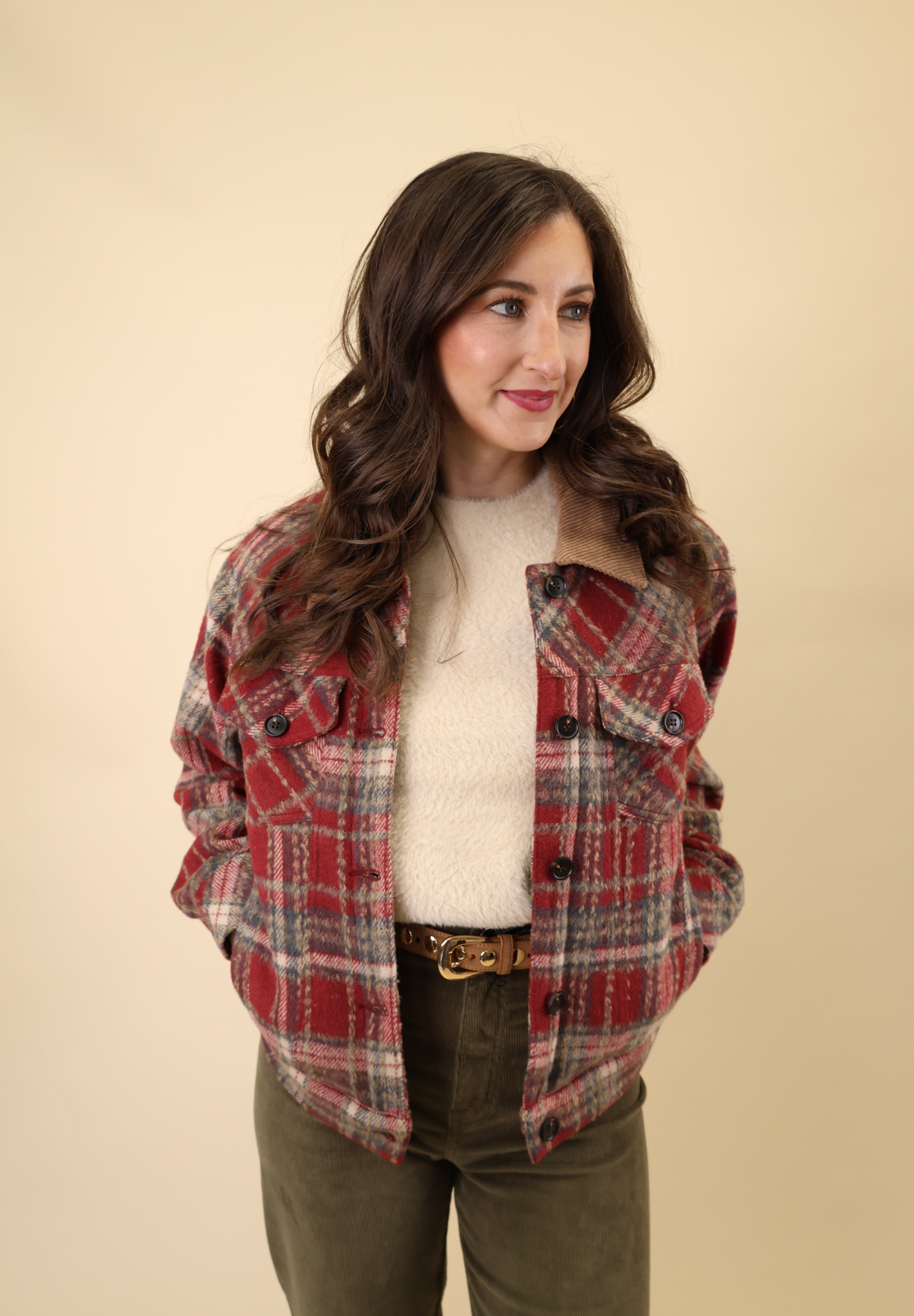 Dear John red plaid trucker jacket showcasing sherpa lining, long sleeves, welt pockets, and a traditional button-front closure.