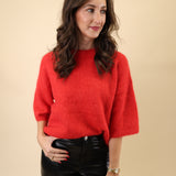 Cozy red crewneck Pistola sweater featuring relaxed dropped shoulders and mid-length sleeves.