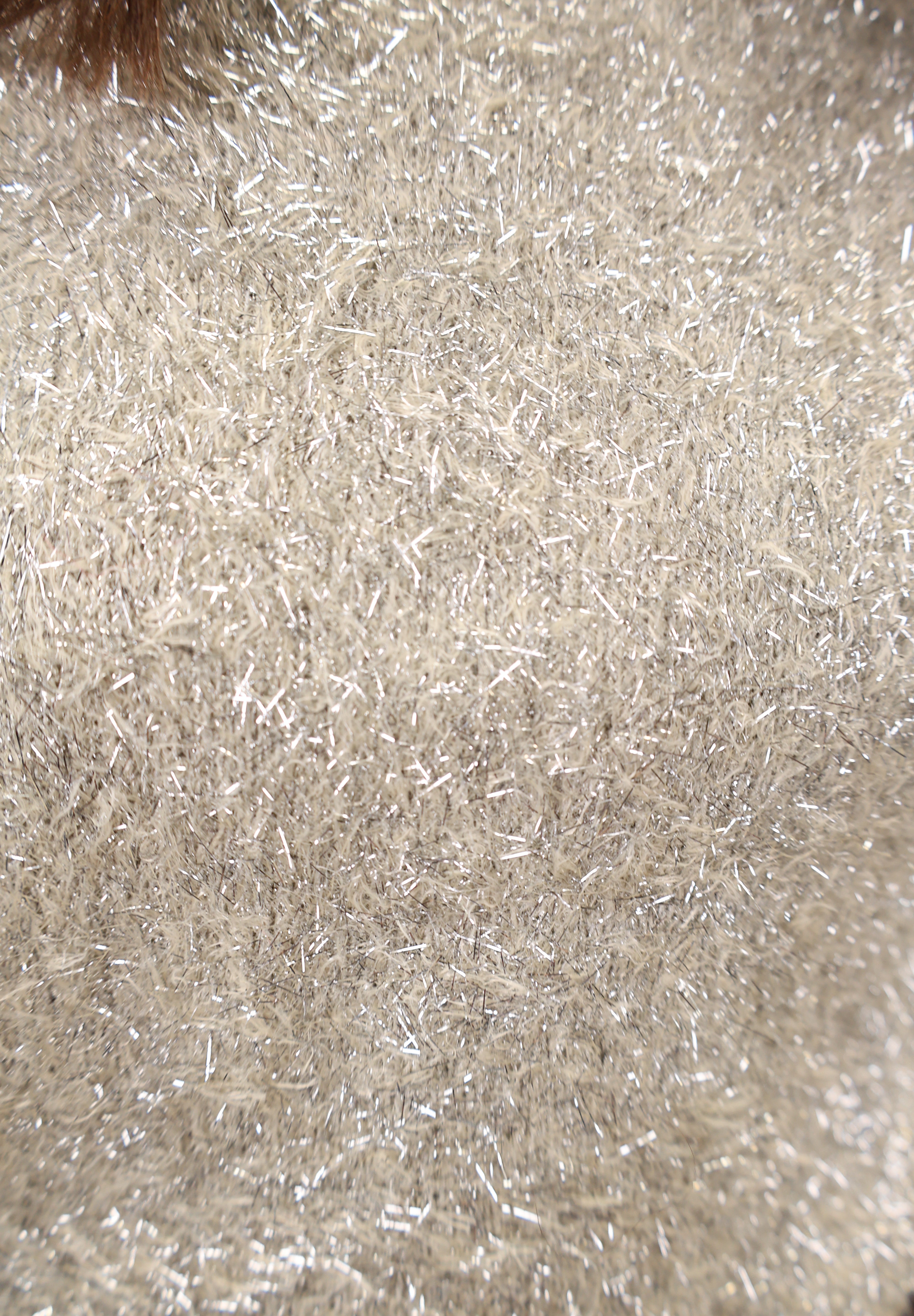 Close up of metallic-knit Tinseltown pullover from Z Supply, lightweight with a classic crew neck and long sleeves.