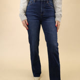 High-rise dark indigo jeans by Pistola featuring a slim fit through the leg and a subtle bootcut hem.