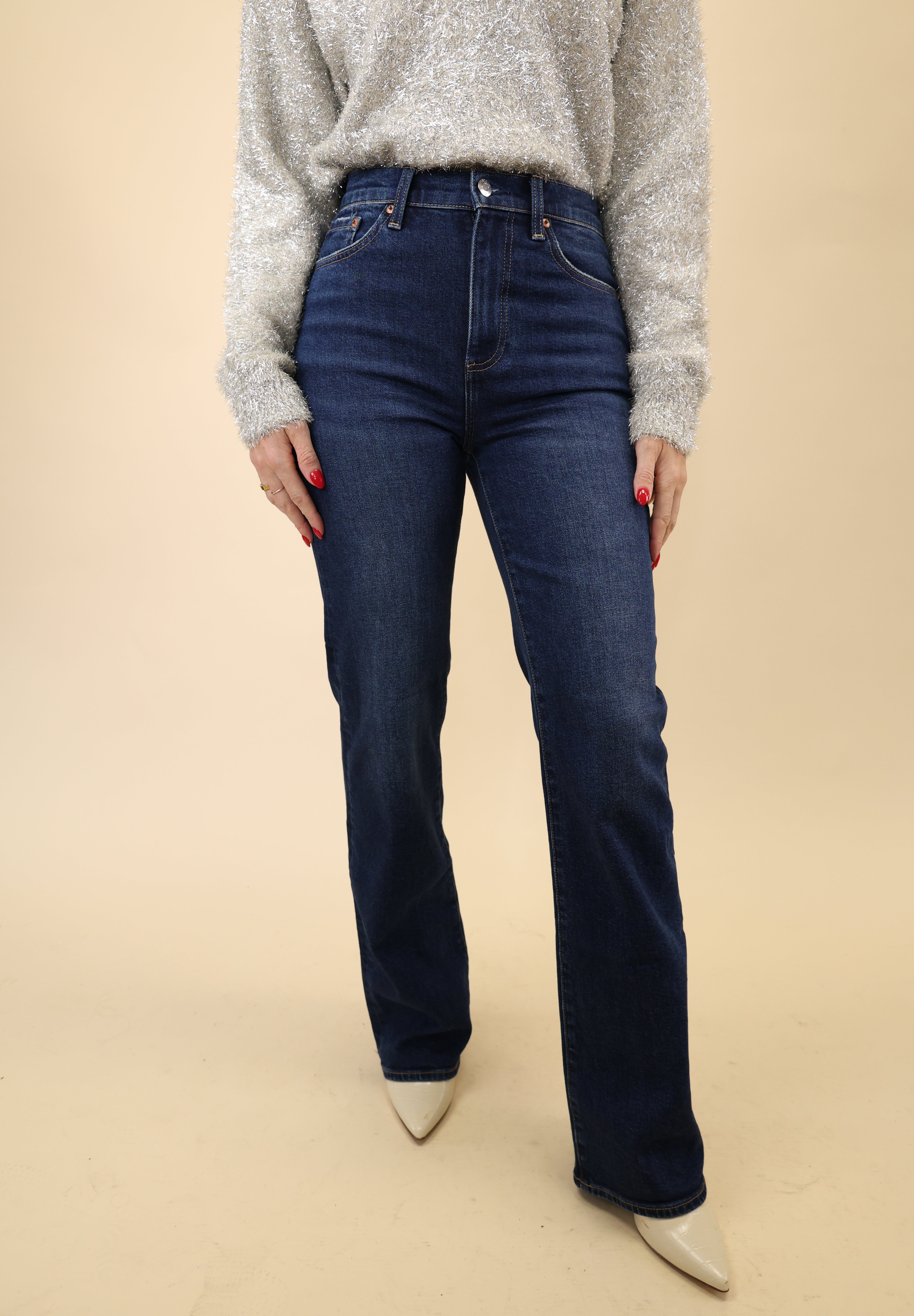 High-rise dark indigo jeans by Pistola featuring a slim fit through the leg and a subtle bootcut hem.