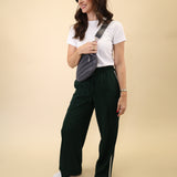 Wide-leg green Z Supply Saunder Track Pant with a lightweight feel, high waist, and crisp white stripes running down the seams.