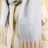 Blue Free People Winter Chill blanket scarf featuring a plush knit feel and contrasting cream fringe trim for added texture.
