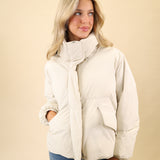 Pistola Donovan jacket in white featuring a lightweight nylon puffer design with a hidden zipper and side pockets.