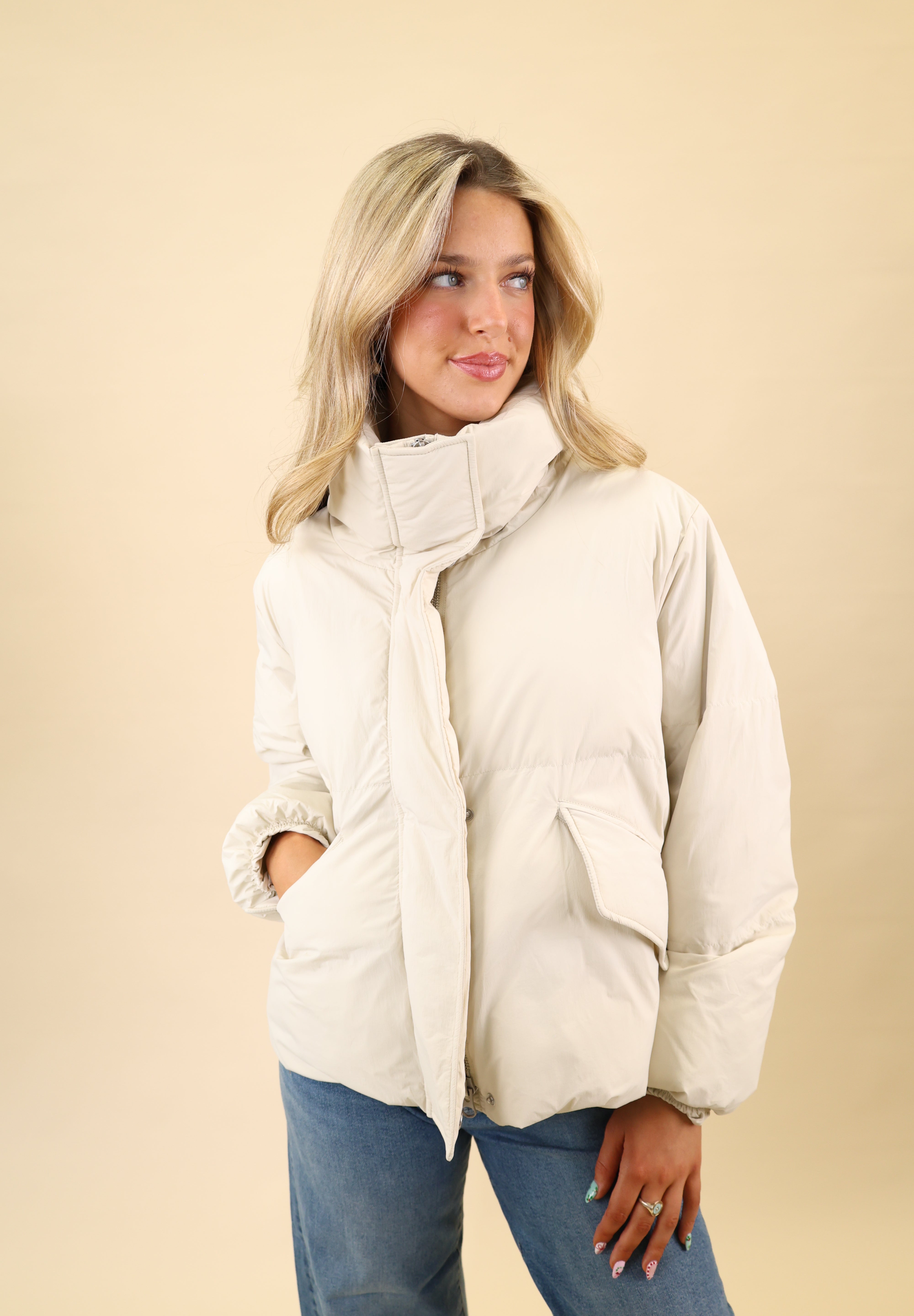 Pistola Donovan jacket in white featuring a lightweight nylon puffer design with a hidden zipper and side pockets.