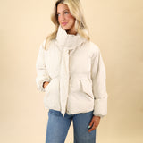 White Donovan jacket by Pistola featuring a sleek nylon puffer silhouette, hidden zipper front, and pocket detailing.