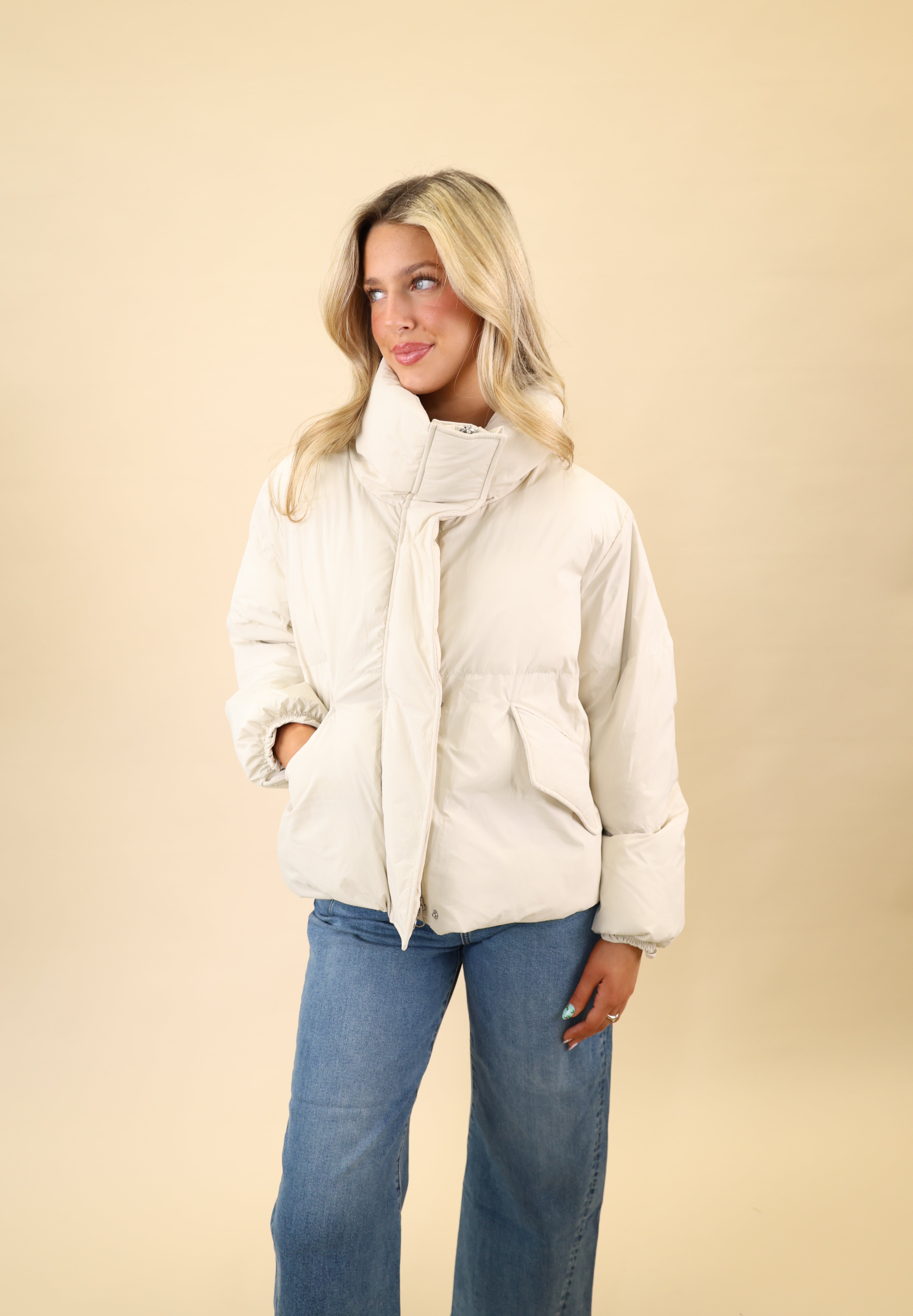White Donovan jacket by Pistola featuring a sleek nylon puffer silhouette, hidden zipper front, and pocket detailing.