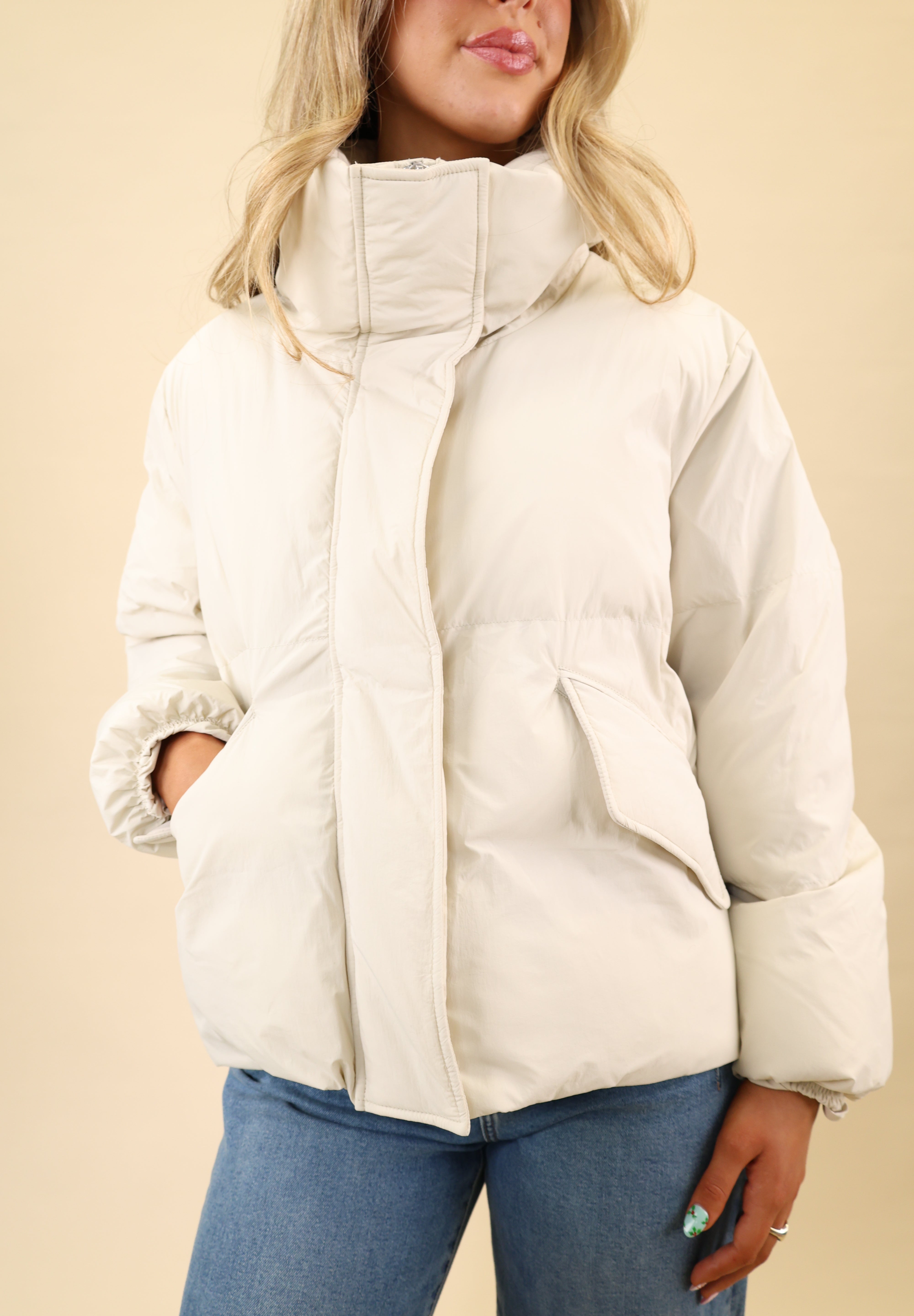 White Pistola Donovan puffer jacket made from nylon, designed with a concealed front zipper and functional pockets.