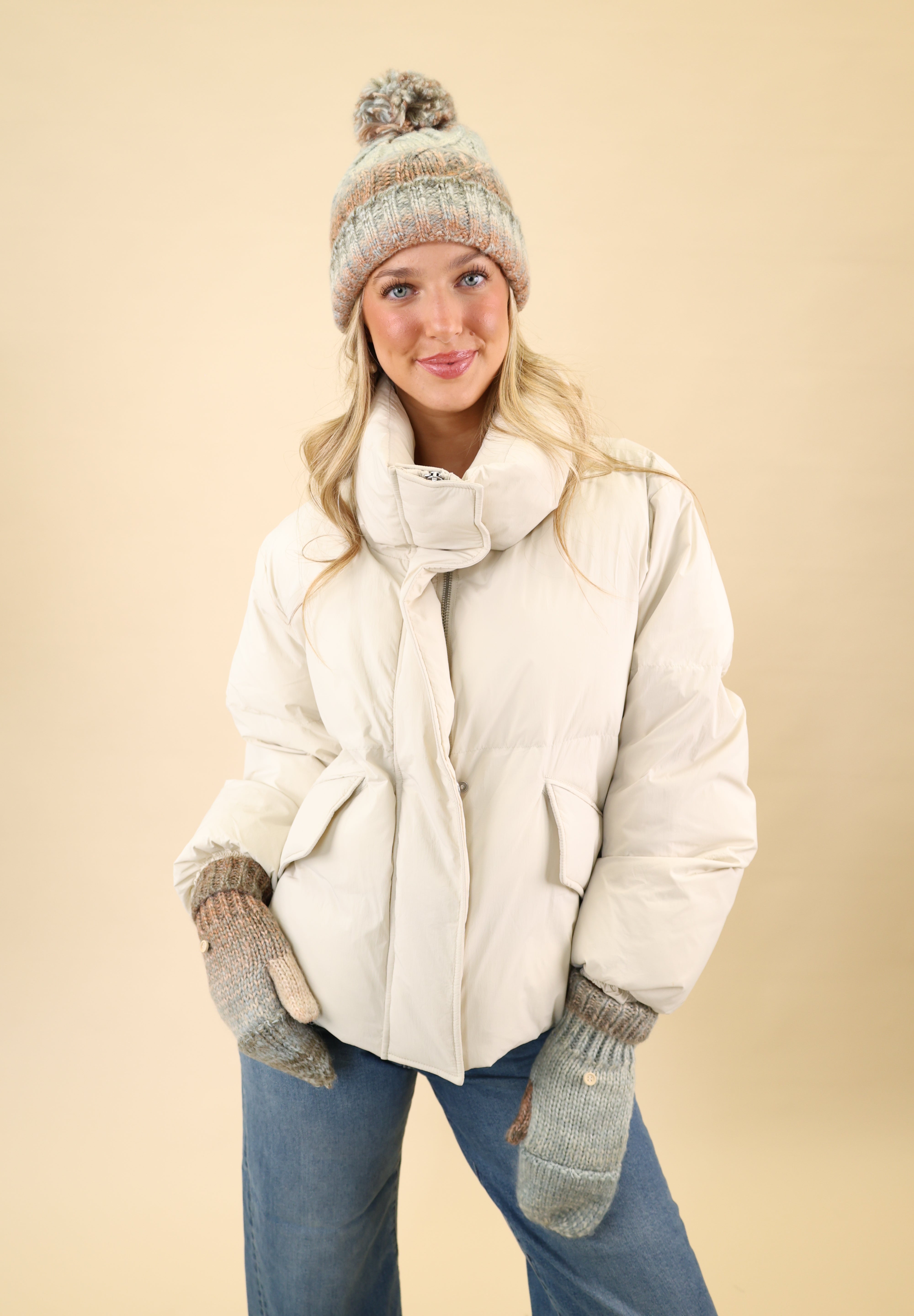 Free People Rainbow Run hat and gloves set featuring a chunky knit beanie with pom pom and matching convertible mitten gloves with ribbed trim.