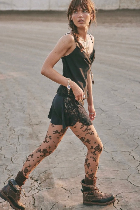 Sheer Free People tights featuring soft flocked blossoms and delicate floral detailing
