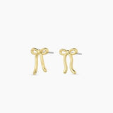 Gorjana Bow Earrings — delicate 18k gold-plated studs measuring ½” x 5/16”, featuring a bow design with surgical steel post backs for everyday elegance.