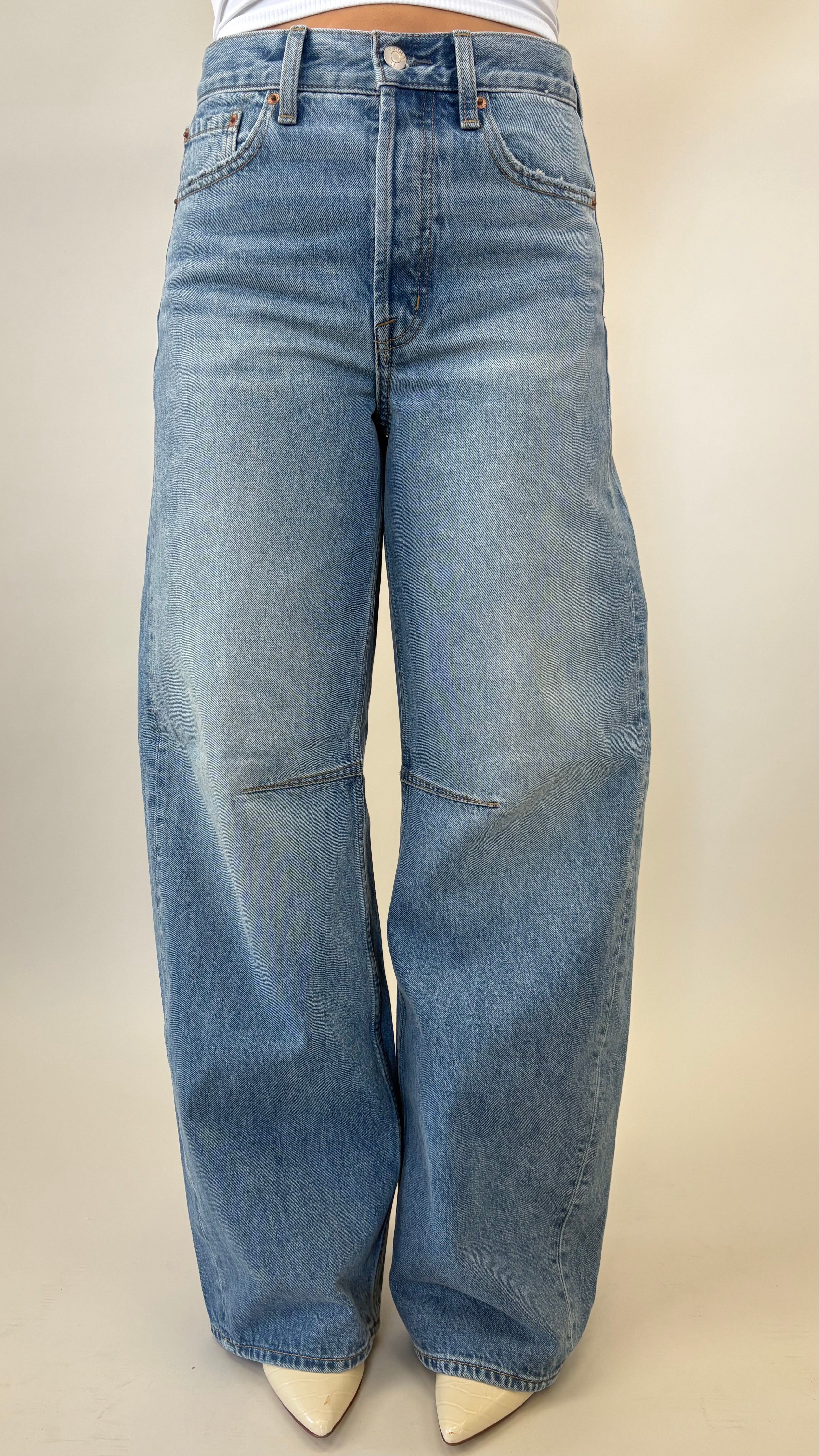 Pistola Sydney high rise bowed leg jeans in light wash denim with full-length wide silhouette